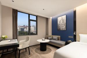 Postel nebo postele na pokoji v ubytování 啡诺美居 + 23 fotografií