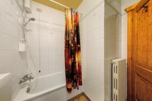 a bathroom with a shower and a bath tub at Appartamento Privato Nelle Dolomiti in Vodo Cadore +18 photos