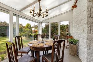 a dining room with a table and chairs at Haus am See in Müllrose