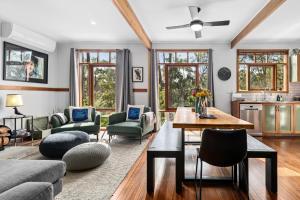 a living room with a couch and a table at Hepbirds in Hepburn Springs