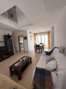 a living room with a couch and a table at Vera Rambla in Vera +12 photos