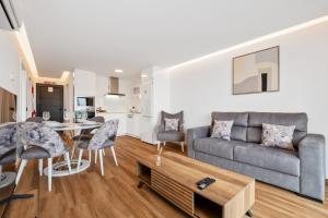 a living room with a couch and a table at Golden Home V in Caniçal