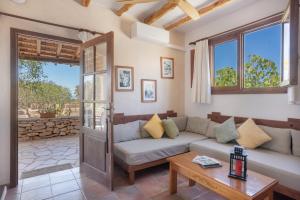 a living room with a couch and a table at Can Mussenya 2 in Illes Balears