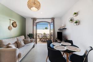 a living room with a couch and a table at Casa Tagoro Dream in Costa Del Silencio