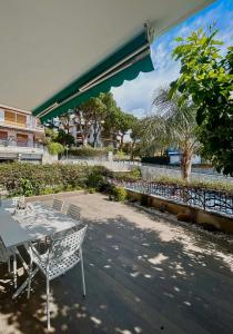 a table and chairs sitting on a patio at Appartamento Stella Marina in Sanremo