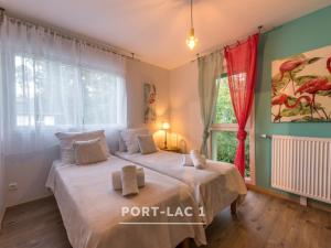 En eller flere senge i et værelse på Port-Lac 1 & 2 - Lac D'Annecy