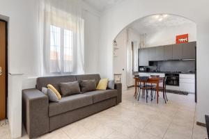 a living room with a couch and a table at La dimora del Gallo in Concorezzo