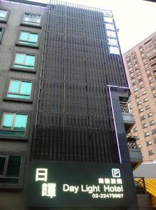 a tall building with a day light hotel sign on it at Daylight Hotel in Zhonghe