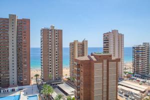 a view of a city with tall buildings and the ocean at Serisol Holidays in Benidorm