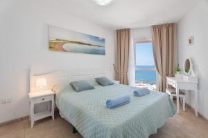 Postel nebo postele na pokoji v ubytování Amazing view over the ocean Y + 20 fotografií