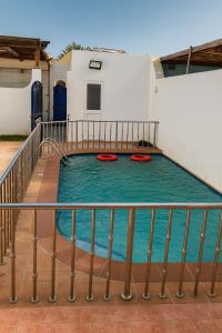 two frisbees are sitting in a swimming pool at فيلا برادايس in Jeddah