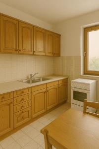 a kitchen with wooden cabinets and a sink at Orange Rooms in Tirana