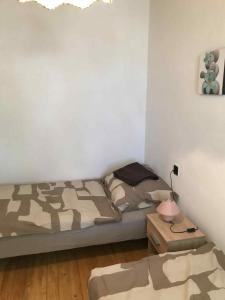 Postel nebo postele na pokoji v ubytování Tomi Vendégház + 6 fotografií