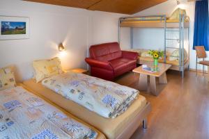 Postel nebo postele na pokoji v ubytování Hotel Sörenberg