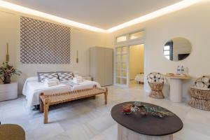 a bedroom with a bed and a table at Luces de Catedral in Alicante