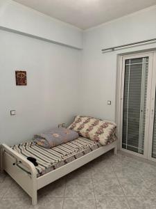 Postel nebo postele na pokoji v ubytování Άνετη Κατοικία για Απόδραση στη Λίμνη Πλαστήρα