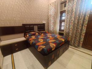 a bedroom with a bed and a window at 2BHK Central Gurgaon in Gurgaon