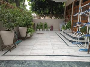 a courtyard with potted plants on the ground at 2BHK Central Gurgaon in Gurgaon