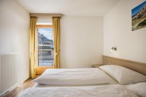 Postel nebo postele na pokoji v ubytování Runcac Apt Corn