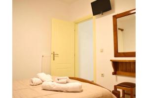 Postel nebo postele na pokoji v ubytování Manolika Studio 2