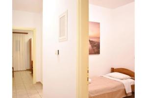 Postel nebo postele na pokoji v ubytování Manolika Studio 2