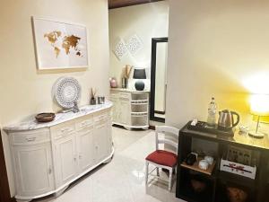 a living room with white cabinets and a mirror at To Be Apartments in Bobadela +22 photos