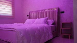 Ένα ή περισσότερα κρεβάτια σε δωμάτιο στο apartment in the center for an excellent stay