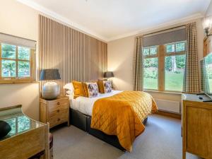 Ένα ή περισσότερα κρεβάτια σε δωμάτιο στο Morar Lodge