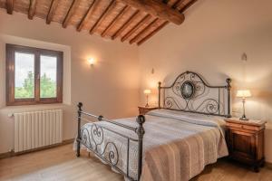 Postel nebo postele na pokoji v ubytování Agriturismo La Castellina + 46 fotografií