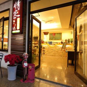 a store front with a figurine in front of a door at Love in Hualien B&B in Hualien City