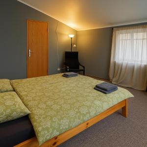 Ένα ή περισσότερα κρεβάτια σε δωμάτιο στο Objekts Guesthouse - Creative Quarter Apartment