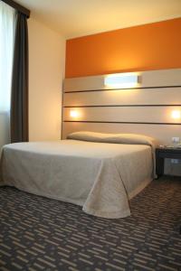 Postel nebo postele na pokoji v ubytování Hotel Verdina