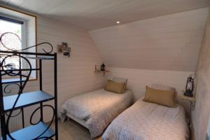 Ένα ή περισσότερα κρεβάτια σε δωμάτιο στο L'Échappée Belle - Gite Châteaux