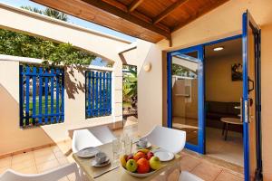 a dining room with a table with a bowl of fruit on it at Sun and Beach Bahia Feliz 1 in San Agustin
