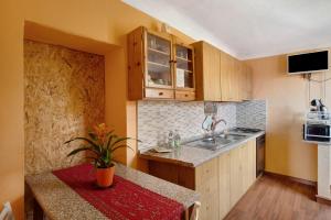 a small kitchen with a sink and a counter at Casa Vita in Vallebona +13 photos