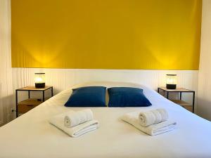 Postel nebo postele na pokoji v ubytování City Break des Sacres de Reims Forum