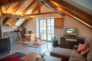 a living room with a couch and a table at Mulino Glurns in Glorenza