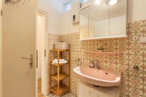 a small bathroom with a sink and a mirror at Ferienwohnung Figelius in Herscheid +12 photos
