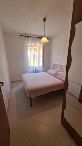 Ένα ή περισσότερα κρεβάτια σε δωμάτιο στο Veglio 2 Como Lake and Mountain