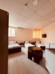 Ένα ή περισσότερα κρεβάτια σε δωμάτιο στο Hiland Hostel