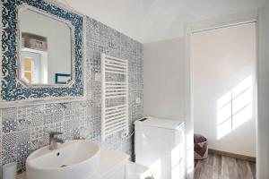 a bathroom with a sink and a mirror at Casa Daneri 59 in Bonassola +18 photos
