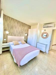 a bedroom with a large bed in a room at Paradise Dreams in Maspalomas