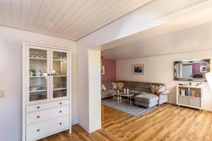 a living room with a couch and a table at Haus im Igelweg in Bad Münstereifel