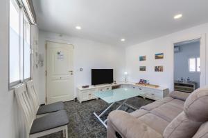 TV a/nebo společenská místnost v ubytování Piso Vacacional Zapillo