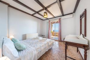 a bedroom with a bed and a sink at Villa Marianthi-kaizer Bridge in Achílleion
