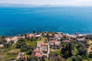 an aerial view of a small village by the water at Villa Marianthi-kaizer Bridge in Achílleion