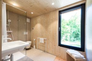 a bathroom with a sink and a window at mini mal anders in Altmannstein