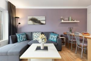 a living room with a couch and a table at Panorama Schönberg 02 in Schönberg