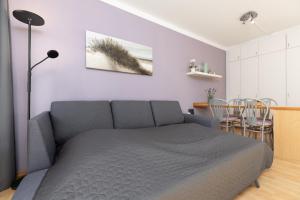 a bedroom with a bed and a table with chairs at Panorama Schönberg 02 in Schönberg