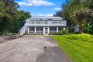 a large white house with a porch at CA411: 411 Carolina Blvd. in Isle of Palms